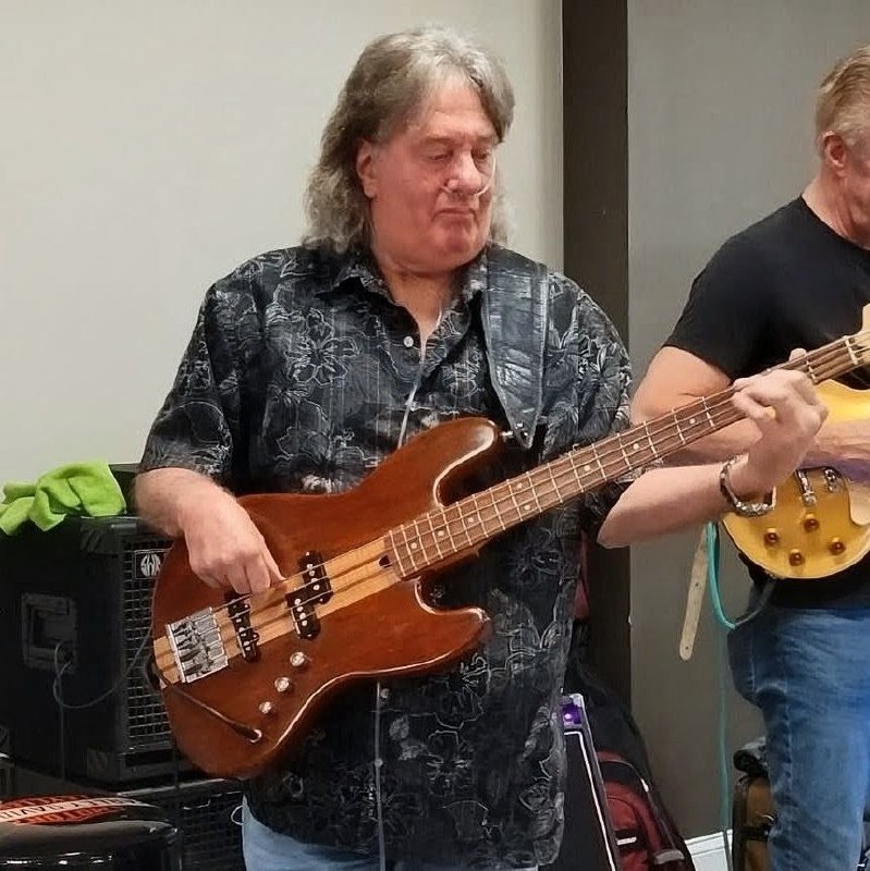 Bill Thorpe playing fretless bass with eyes closed